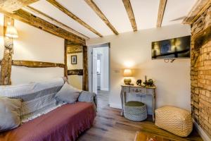 a living room with a couch and a table at 3 Bed in Callaughton oc-b34809 in Much Wenlock