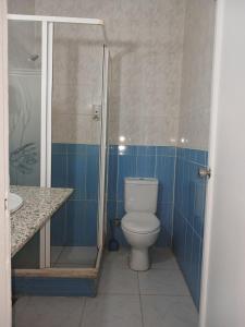 a bathroom with a toilet and a shower and a sink at Regency Hotel Sharm in Sharm El Sheikh