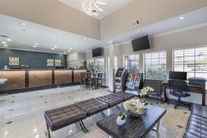 a living room with a pool table and a bar at Best Western Airpark Hotel - LAX Airport LA Stadium in Inglewood