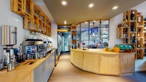 a large kitchen with a counter in a store at Biohotel Schönhagener Mühle in Pritzwalk