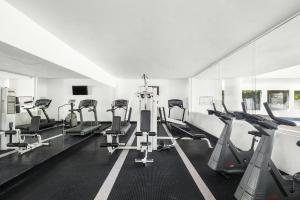 a gym with several treadmills and cardio machines at Fiesta Inn Express Hermosillo in Hermosillo