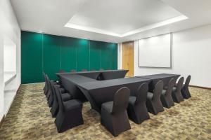 a conference room with a long table and chairs at Fiesta Inn Express Hermosillo in Hermosillo