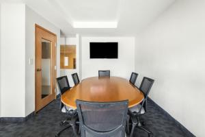 a conference room with a wooden table and chairs at Fiesta Inn Express Hermosillo in Hermosillo