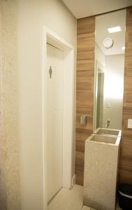 a bathroom with a sink and a mirror at Polar Rio Hotel in São Paulo +58 photos