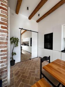 a dining room with a door leading into a kitchen at Exceptional Home-5 min from Porto Montenegro Tivat in Tivat