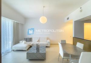 a living room with a couch and a table at Gate Tower, 1BR Reem Island, Near Galleria, Abu Dhabi Mall & the City in Abu Dhabi