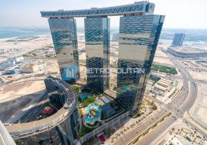 an aerial view of a tall building in a city at Gate Tower, 1BR Reem Island, Near Galleria, Abu Dhabi Mall & the City in Abu Dhabi