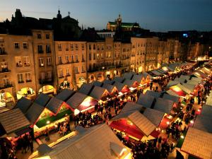 a group of market stalls in a city at night at Loft Le Saint Louis by La Chambre à Coté in Metz