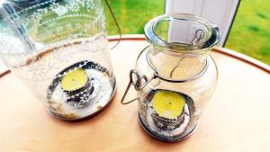 a glass jar with lemons in it sitting on a table at Tigh Na Sith in Aultbea