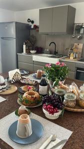 a kitchen with a table with food on it at Thesan B&B in San Prisco