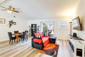 a living room with a couch and a table at Work, Explore & Unwind: Greenville Getaway w/ Yard in Greenville