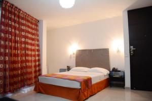 Ένα ή περισσότερα κρεβάτια σε δωμάτιο στο Hotel Calima Real
