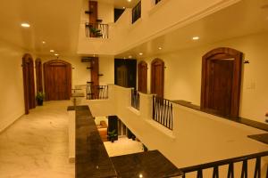a large hallway with stairs in a building at Haraa Suites Tiruvannamalai in Tiruvannāmalai