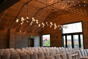a large room with rows of chairs and a chandelier at The Wisconsin Hotel & Conference Center in Wisconsin Dells +29 photos