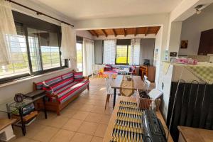 a living room with a couch and a table at Villa Maty in Karianí +33 photos
