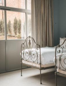 a bedroom with a bed in front of a window at Palé Hall Hotel & Spa in Bala +54 photos