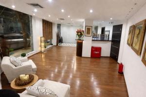 a living room with a hard wood floor at INOH Athens Hotel in Athens
