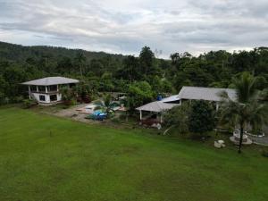an aerial view of a house and a yard at PARADISE LODGE in Tena