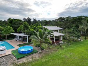 an aerial view of a house with a swimming pool at PARADISE LODGE in Tena