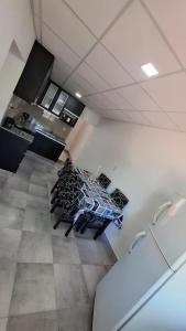 a kitchen with a table in the middle of a room at Sisters Place in Guaymallen