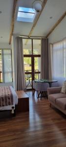 a living room with a couch and a table at Florez de la Villa Apartments & Suites in Cusco
