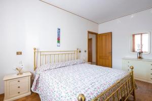 a bedroom with a bed and a dresser and a window at Il Melograno, appartamento privato in Cavriago