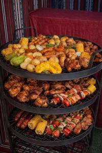 a three tiered display of different types of food at Wadi rum Rozana camp in Wadi Rum