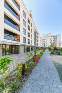 an empty sidewalk in front of a building at KOA - Signature Collection in Braşov