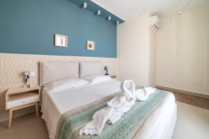 a bedroom with a bed with a towel on it at Penelope al mare 6 in Alba Adriatica