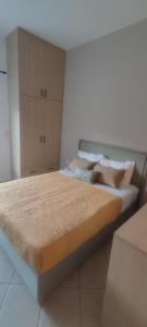 a bedroom with a large bed in a room at Casa Oliva in Ermoupoli