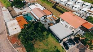 an overhead view of a house with a garage at Roga Village in Atibaia +15 photos