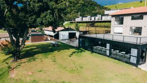 an aerial view of a house with a yard at Roga Village in Atibaia
