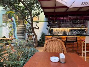 a table and chairs in front of a restaurant at SMALL Boutique & Garden in Tirana