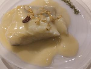 a white plate with a piece of food on it at El rincón del Vadillo in La Velilla +30 photos