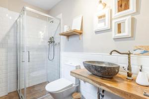 a bathroom with a sink and a shower at Ca'n Tosca Jávea in Jávea