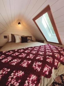 a bedroom with a large bed with a large window at Campo Carnelian in Carnelian Bay