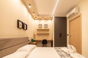 a bedroom with a bed and a desk at Penelope al mare 20 in Alba Adriatica