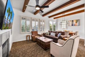a living room with a couch and a fireplace at Poolside Greens 2BR Legacy Villa in La Quinta