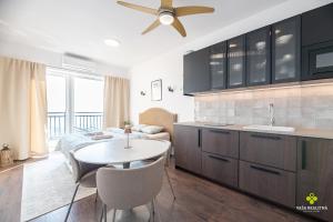 a kitchen with a table and a dining room at Castle Studio 7 Bojnice in Bojnice