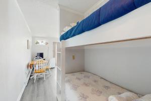 a bedroom with a bunk bed and a desk at NTBTR329 Totally Topsail in North Topsail Beach