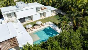 an aerial view of a house with a swimming pool at Villa Marazul 5BR Beach & Golf Access in Cancún