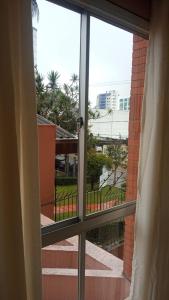 a view from a window of a balcony at AP perto do HSVP com estacionamento in Passo Fundo