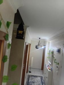 a room with a hallway with a staircase and a light at Edebiyat Apartments in Istanbul