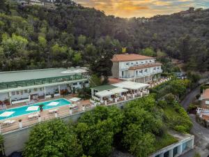 an aerial view of a resort with a swimming pool at Hotel Vittoria in Porto Santo Stefano