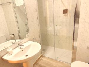 a bathroom with a shower and a sink and a toilet at Caballeros 7 in Soria
