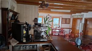 a kitchen with a coffee maker on a counter at Chambre de charme in Berbezit