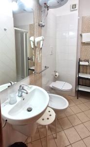 a bathroom with a sink and a toilet at B&B AeR in Lesina +40 photos