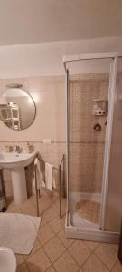 a bathroom with a shower and a sink at Bettyhouse in Sasseta +30 photos