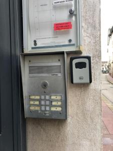 a pay meter on the side of a building at Le Nid Bressan in Bourg-en-Bresse