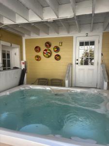 a large hot tub in front of a house at LasPalmas Beach Rentals,3 in Bradenton Beach